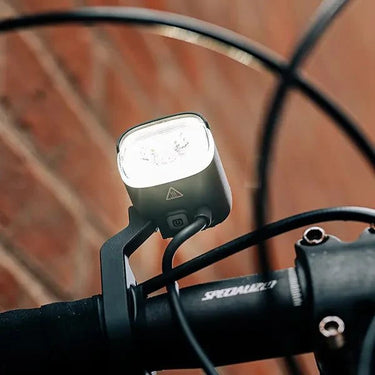 Magicshine ME 1000 smart e-bike light mounted on bike handlebars