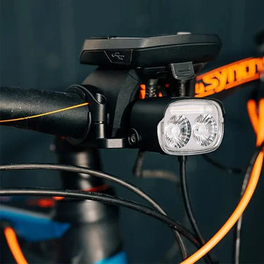 Magicshine ME 2000 smart e-bike light mounted on a bicycle handlebar