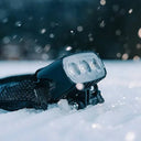 ScoutLite Megle Multi-Functional Headlamp emitting 6000 lumens with adjustable 220-meter beam for outdoor activities