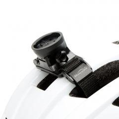 Magicshine Helmet Garmin Mount attached to white bicycle helmet with adjustable strap and mounting base.