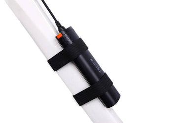 Magicshine MJ-6116C rechargeable USB battery pack with round plug mounted on white frame