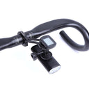 Magicshine TTA Out-Front Bike Mount holding light and cycle computer on black bike handlebar