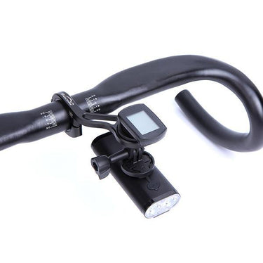 Magicshine TTA Out-Front Bike Mount holding light and cycle computer on black bike handlebar