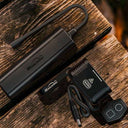 Magicshine Monteer 8000S bike light with remote on wooden surface for epic adventures